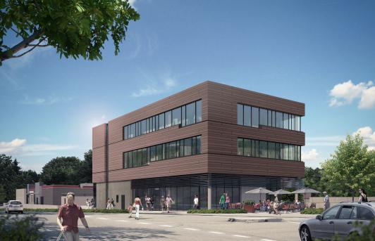 Das Gewerbeareal Sonneneck an der Stuttgarter Straße in Freudenstadt mit moderner Gewerbe- und Büroarchitektur, großzügigen Fensterflächen und erdfarbener Fassadengestaltung. Die Projektentwicklung vereint in drei Gebäudeteilen unterschiedliche Nutzungen aus Einzelhandel, Gastronomie, Dienstleistung, Fitness und Büro sowie 18 Wohnungen zu einem gemischt genutzten Quartier. Naturstein im Sockelbereich, erdige Farbtöne und die horizontale Gliederung greifen Bezüge zur historischen Architektur Freudenstadts auf. Projektentwicklung, Planung und Umsetzung durch arc+ GmbH Freudenstadt.